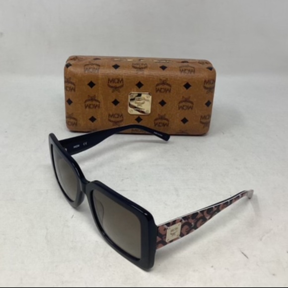 MCM Women's Black Sunglasses with Brown Patterned Arms